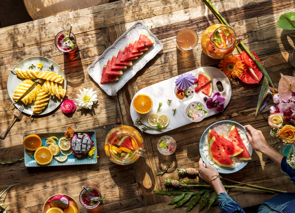 Outdoor tableware filled with summer fruits