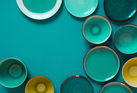 Rustic glazed plates in teal